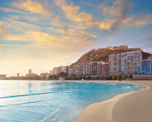 Golden sand and clear waters of Postiguet Beach in Alicante